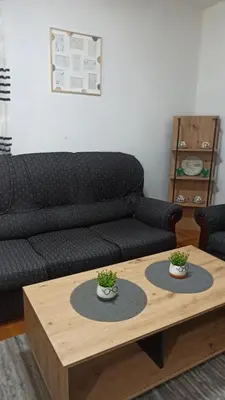 a living room with a couch and a coffee table at Martha`s place Drač in Podgorica