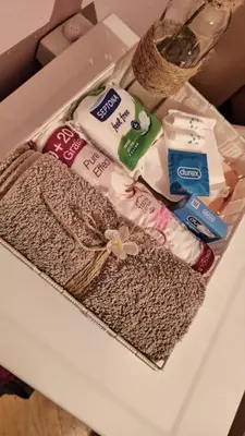 a box of towels and other items on a table at Martha`s place Drač in Podgorica