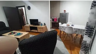 a living room with a couch and a table at Martha`s place Drač in Podgorica