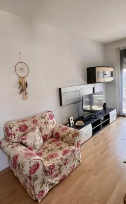 a living room with a couch and a tv at Lovely Modern LUX flat near to the center in Podgorica