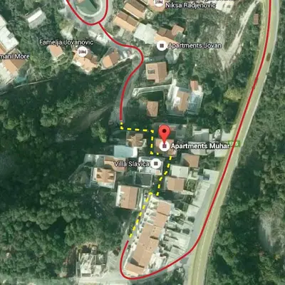 a map of a road with a red circle at Apartments Muhar in Sveti Stefan