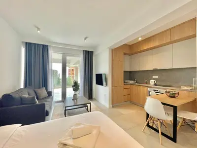 a living room with a couch and a table at Horizon Residences Andjela in Budva