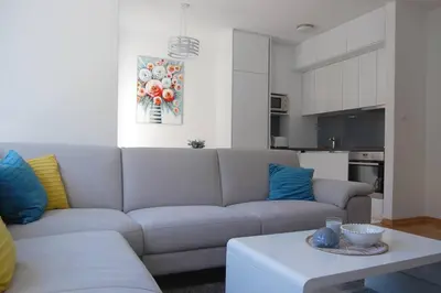 a living room with a couch and a table at Status-M Apartments 85 in Becici