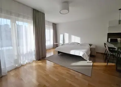 a bedroom with a bed and a large window at Status-M Apartments 102 in Becici