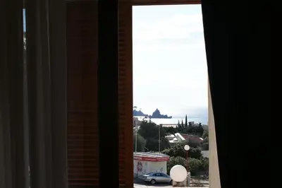 a window view of the ocean from a building at Engora 2 in Petrovac na Moru