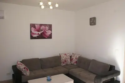 a living room with a couch and a table at Engora 2 in Petrovac na Moru