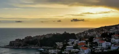 a view of a town on a hill with the ocean at Apartment A4 in Ulcinj