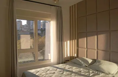 a bedroom with a bed and a large window at Status-M apartments 98 in Becici