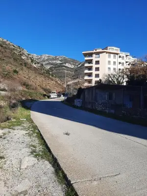 an empty road with a building in the background at Marina Apartment in Becici