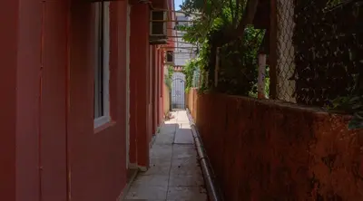 an empty alley way with a building and a window at Family Apartments Vukcevic in Čanj