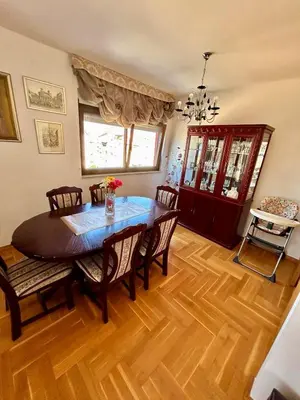 a dining room with a table and chairs at Panorama Bar 2 bedroom in Bar