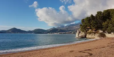 a beach with trees and water and mountains at Panorama Bar 2 bedroom in Bar