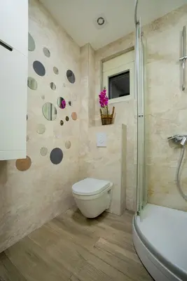 a bathroom with a toilet and a shower at Apartment Boka View in Kotor