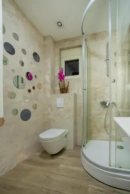 a bathroom with a shower and a toilet and a sink at Apartment Boka View in Kotor