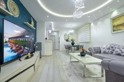 a living room with a couch and a tv at Apartment Boka View in Kotor