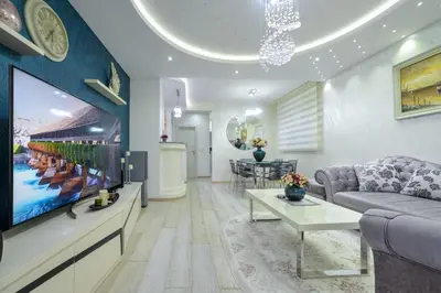 a living room with a couch and a tv at Apartment Boka View in Kotor