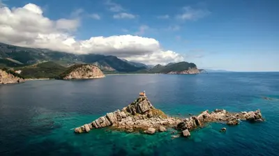 an island in the middle of a large body of water at Apartments Viktorija in Petrovac na Moru