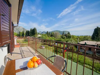 a bowl of fruit on a table on a balcony at Apartments Viktorija in Petrovac na Moru