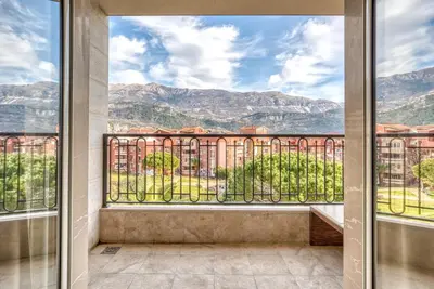 a balcony with a view of the mountains at Apt 