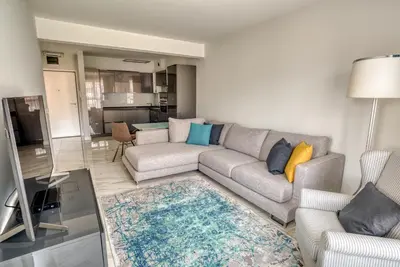 a living room with a couch and a table at Apt 