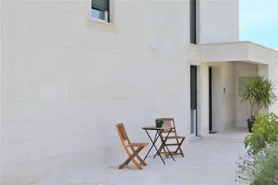 two chairs and a table on a patio at Villa Gabriela in Kotor