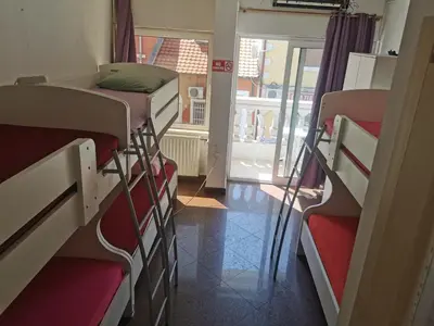 a group of bunk beds in a room at Stars Aspava Blue HOSTEL in Podgorica
