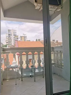 a view of a balcony with a table and chairs at Stars Aspava Blue HOSTEL in Podgorica