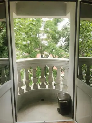a view of a balcony from a window at Stars Aspava Blue HOSTEL in Podgorica