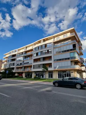 a car parked in front of a building at Sunny City - City Kvart in Podgorica