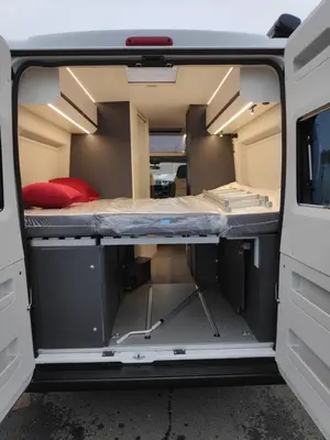 an open door of an rv with a bed at Camper Montenegro and Recreational Vehicles in Budva