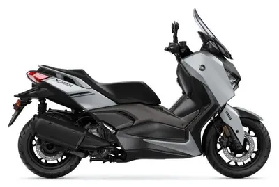 a black and silver motorcycle parked on a white background at Camper Montenegro and Recreational Vehicles in Budva