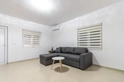 a living room with a couch and a table at Apart-Hotel Prestige in Ulcinj