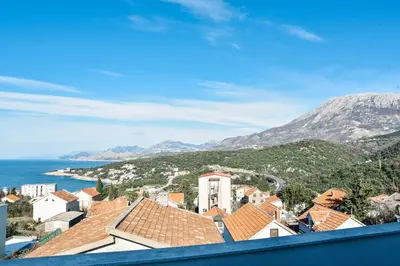 a view of a town with a mountain in the background at Seaview Apartments Bonaca in Bar