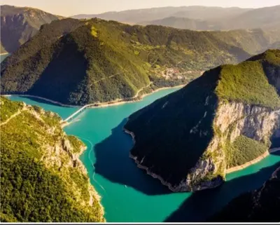 an aerial view of a river between two mountains at Horizon Two bedroom Penthouse with Hot tub in Becici