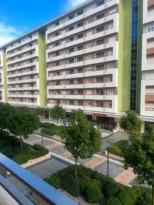 a view of a building from a balcony at White Homes 1BR - Central Point in Podgorica