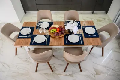 a wooden table with a plate of food on it at Luxury Scandinavian - Villa Montenegro in Ulcinj