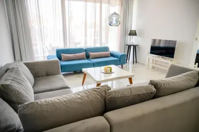 a living room with a couch and a table at Luxury Scandinavian - Villa Montenegro in Ulcinj