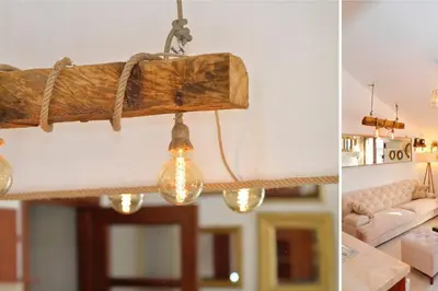 a wooden beam hanging from the ceiling of a living room at Stylish apartment 22 in Kotor