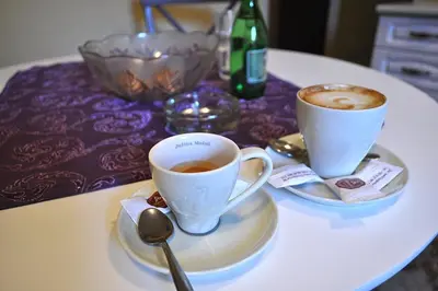 two cups of coffee sitting on a table at Green Hills II by Rent a car MI in Podgorica