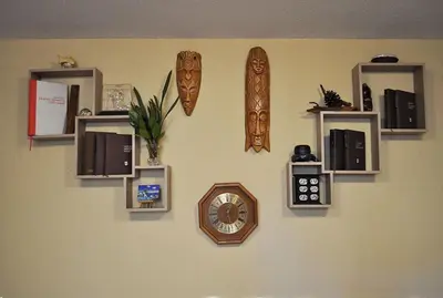 a wall with shelves and a clock on a wall at Green Hills II by Rent a car MI in Podgorica