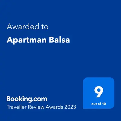 a screenshot of a cell phone with the text awarded to apartmentarian balea at Apartman Balsa in Kotor