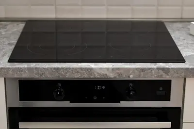 a black stove top oven in a kitchen at Modern Spacious Fully Equipped One Bedroom Apartment in Budva, Free Parking, Ideal for Long Stays in Budva