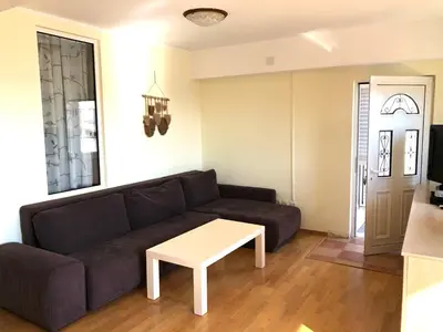 a living room with a couch and a table at Petrovac Holiday Apartments 2 in Petrovac na Moru