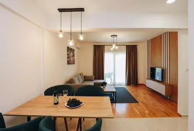 a living room with a table and a couch at Status-M Apartments 134 in Becici