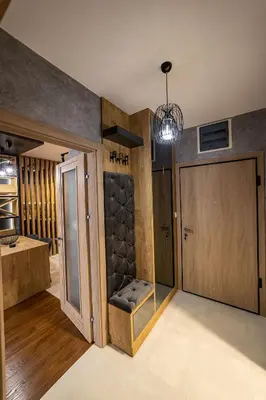 a room with a sliding door and a room with a kitchen at Apartments 28 Master Quart in Podgorica