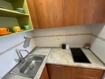 a kitchen with a sink and a counter top at Exclusive studio, great location in Podgorica