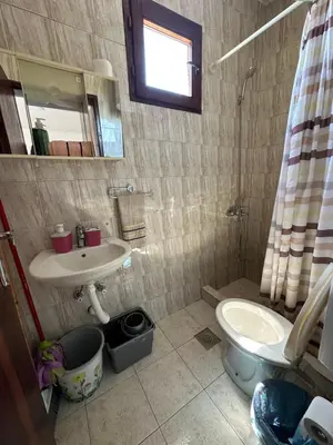 a bathroom with a sink and a toilet at Apartments Plaza in Ulcinj