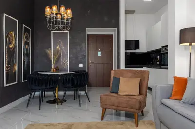 a living room with a table and a couch at The Dream Getaway & Spa by DeVasco in Becici