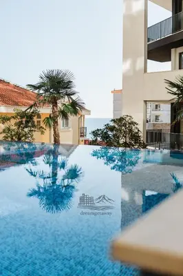 a swimming pool in the middle of a building at The Dream Getaway & Spa by DeVasco in Becici
