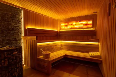 a wooden sauna with a bucket in it at The Dream Getaway & Spa by DeVasco in Becici